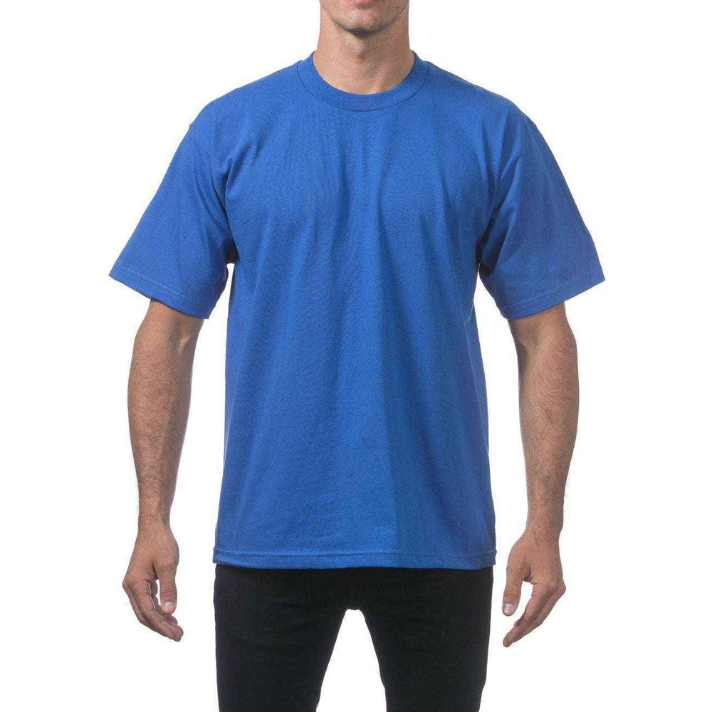 Model wearing a blue Pro Club Heavyweight T-Shirt with short sleeves for comfortable everyday wear